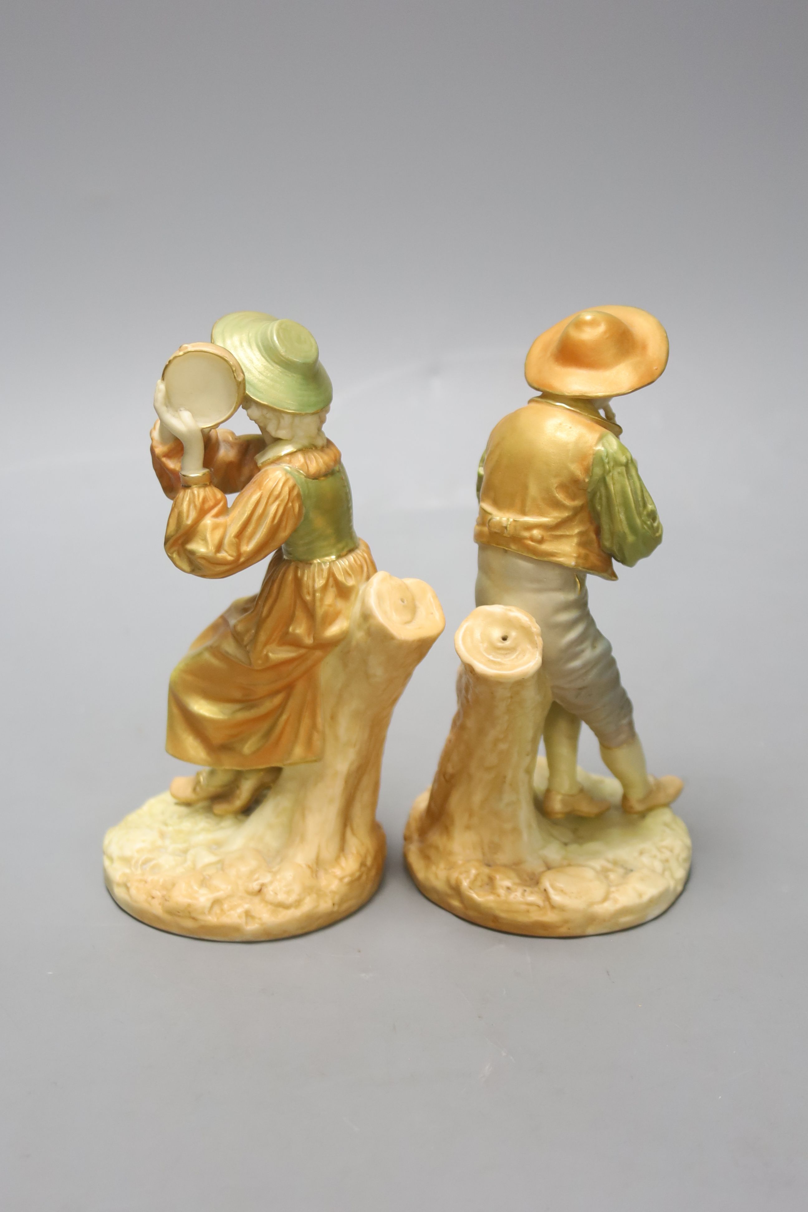 A pair of Royal Worcester figures of Stephen and companion, he with a flute and she with a tambourine, c.1890's, shot enamel mark, height 15cm